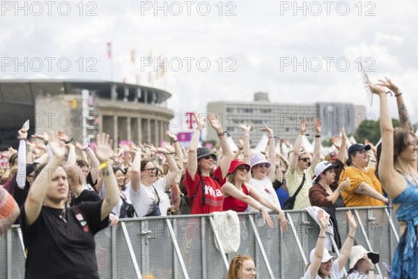 Festival visitors in front of the Olympic Stadium at the Lollapalooza Festival in the Olympic