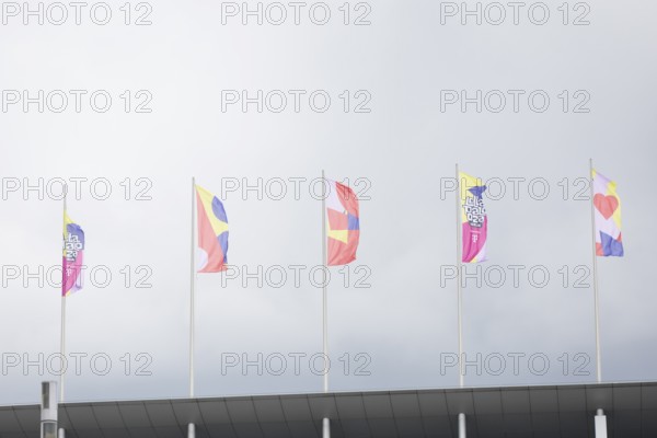 Colourful flags with the Lollapalooza logo on the roof of the Olympic Stadium at the Lollapalooza