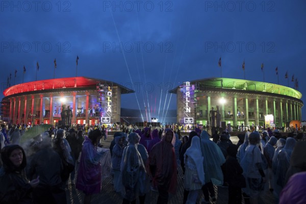 The Olympic Stadium is colourfully illuminated at the Lollapalooza Festival in the Olympic Stadium