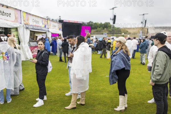 Festival visitors in front of a food stand at the Lollapalooza Festival in the Olympic Stadium and