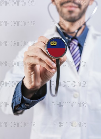 Liechtenstein health and medical insurance concept. Liechtenstein healthcare system, doctor holding