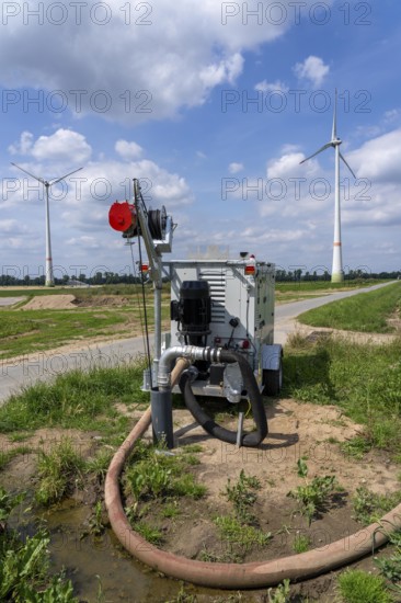 Mobile pump for artificial irrigation with a sprinkler system in a field where sugar beet is grown,