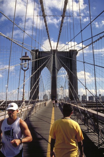 Jogger on the Brooklyn Bridge, New York City, USA
