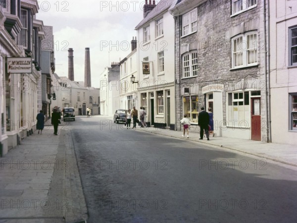 Historic Southside Street, Maritime Inn pub view to chimneys of gin distillery, Barbican, Plymouth,