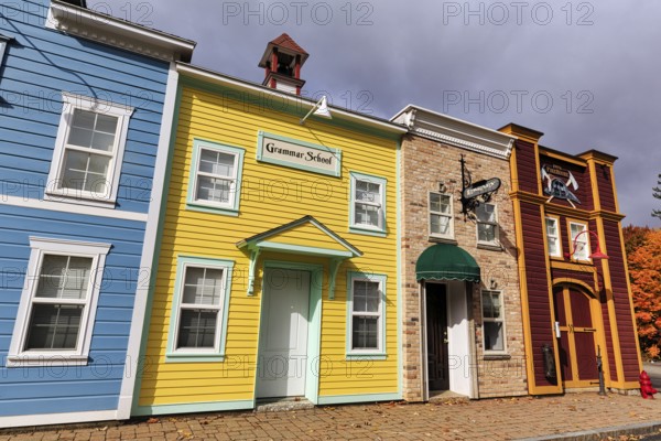 Replica, historic elementary school, colorful facades, signs with inscription, boutique hotel,