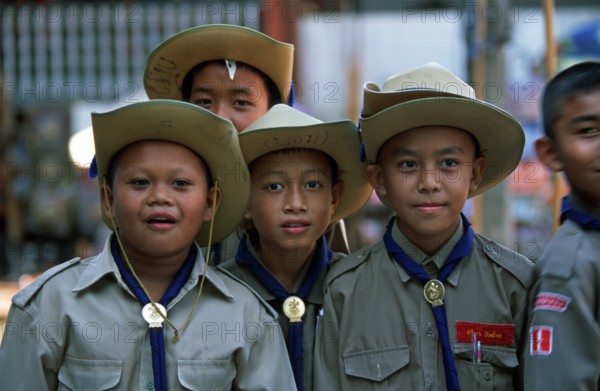 Young scouts at Damnoen Saduak floating market, Thailand, December 2002, vintage, retro, old,