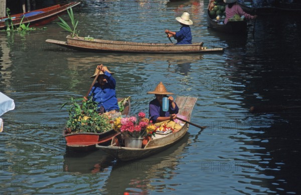 Merchants in their boats at Damnoen Saduak Floating Market, Thailand, December 2002, vintage,