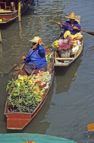Merchants in their boats at Damnoen Saduak Floating Market, Thailand, December 2002, vintage,