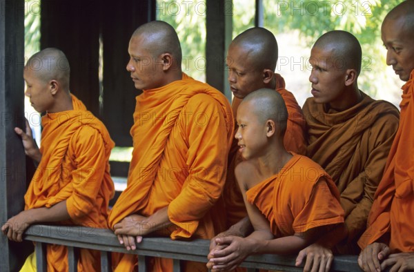 Monks watch performance, Samphran Elephant Ground and Zoo near Bangkok, Thailand, December 2002,