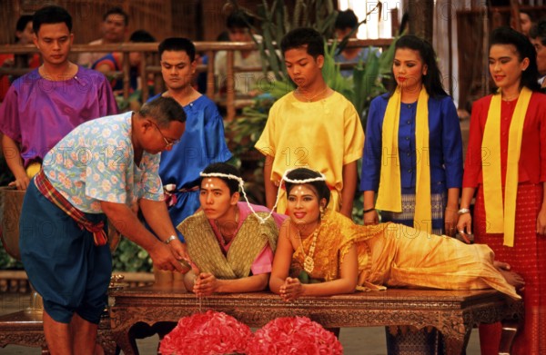 Performance of a traditional wedding ceremony at Rose Garden near Bangkok, Thailand, December 2002,