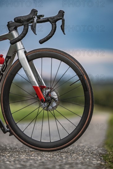 Close-up of a bicycle tire on a country road with cloudy sky, triathlon, Calw, Germany