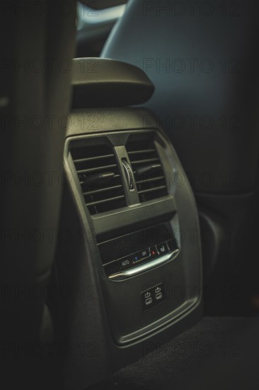Ventilation grille in the interior of a car in dark colors, BMW i7 electric car, Deer e-Carsharing,