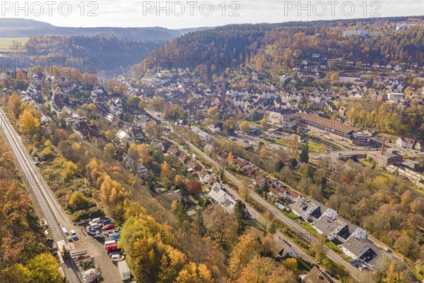 City landscape with autumn colors and railroad tracks from a bird's eye view, Calw, Black Forest,