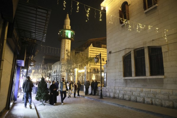 In Damascus, Syria, on December 25, 2025, festive scenes filled the streets and churches of the Bab