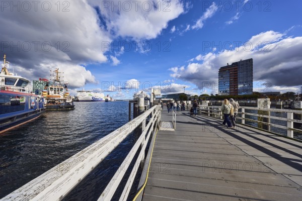 Kiel Fjord, station bridge, pier, wooden railings, wharf, ferries, harbor and sea tugs, ships,