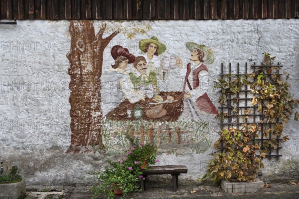 Drinking scene at the time of the Musketeers 17th century, painting on a façade of a farmhouse,