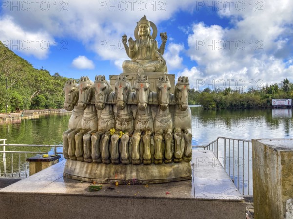 Sculpture statue of sun god Suraya in wagon is pulled from in front of seven 7 horses stands in