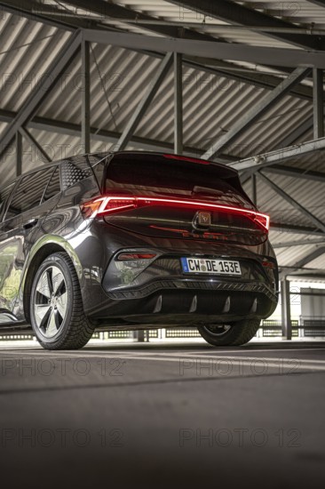 Back view of a black car under a covered parking lot, electric car Cupra, e-car sharing, Calw,