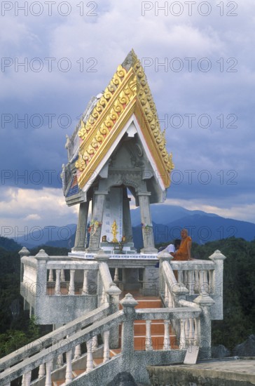 Monk in the monastery of Wat Tam Sua, which is partly on the summit of a mountain, near Krabi,