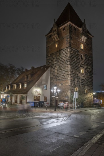 Medieval debt tower in evening lighting, built around 1323, front island of Schütt, Nuremberg,