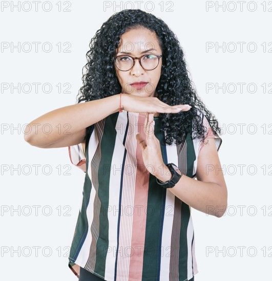 Afro girl gesturing time out isolated. Young afro woman gesturing time out with palms hands