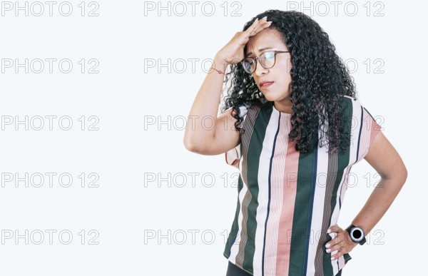 Worried young woman holding his forehead. Worried people isolated holding his head. Tired afro