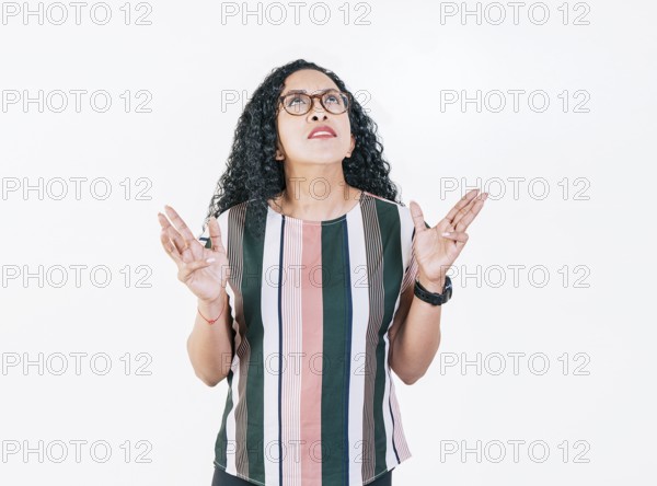 Young woman screaming with her hands in the air. Frustrated girl screaming with hands in the air