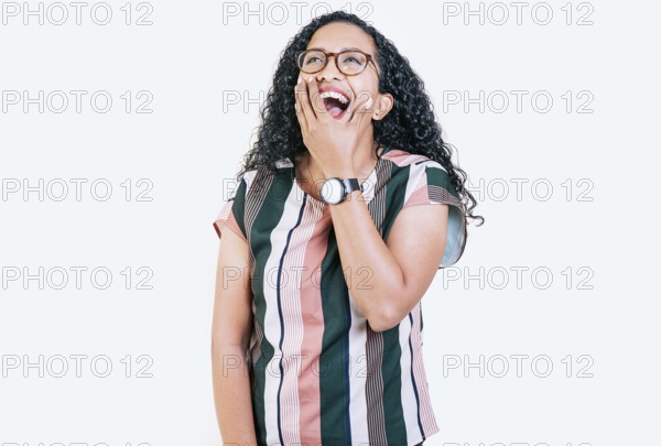 Funny young afro woman laughing on isolated background. Young woman in glasses laughing out loud