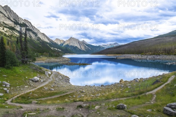 Winding hiking trails traverse the scenic landscape leading to medicine lake, nestled among the