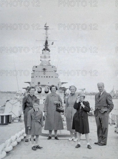Family group of people on Royal Navy HMS Vanguard battleship, Devonport, Plymouth, Devon, England,