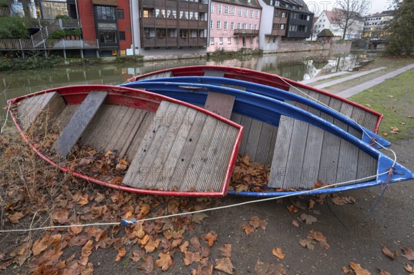 Assembled rowing boats on the banks of Pegnitz, river in Nuremberg, Middle Franconia, Bavaria,