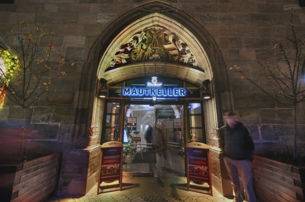 Historic entrance portal to the former Mauthalle, with imperial eagle and city coat of arms, built