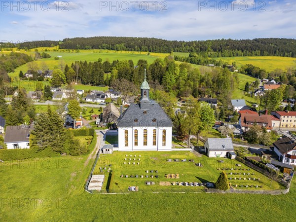 Aerial view, drone photo: Schwarzbach church and cemetery, forest and blooming meadows in the back,