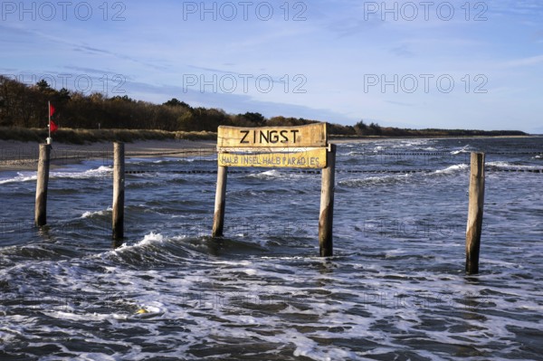 Wooden poles in the sea with wooden sign Zingst Half Island Half Paradise, Zingst,