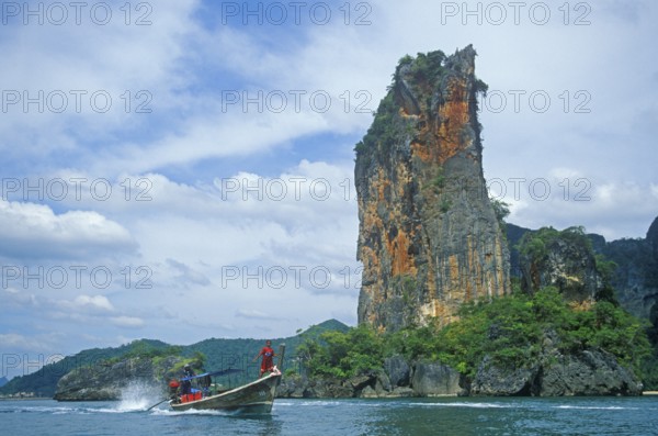 Rocks in the sea, longtail boat, two years in front of the tsunami, Railay, Krabi, Thailand,