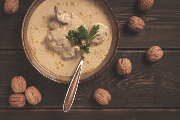 Satsivi, Georgian dish, chicken in nut sauce, cold appetizer, rustic, no people, homemade