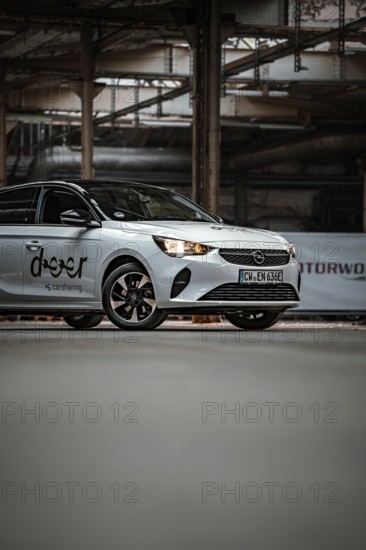 Opel car sharing vehicle with urban flair in an industrial setting, Deer E-Car Sharing, Motorworld
