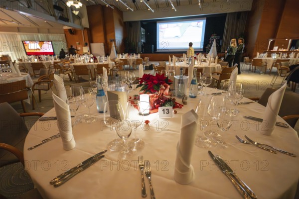 A festively decorated table with Christmas decoration and elegant lighting, Christmas party Dekra