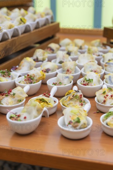 Various small bowls of dim sum arranged on a wooden table, Christmas party Dekra Congresshotel