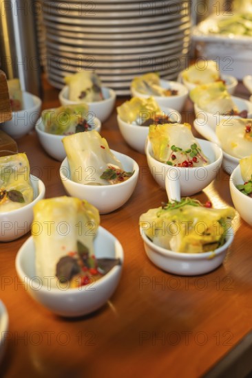 Warm dim sum in small bowls, garnished with spices, Christmas party Dekra Congresshotel Wart, Calw