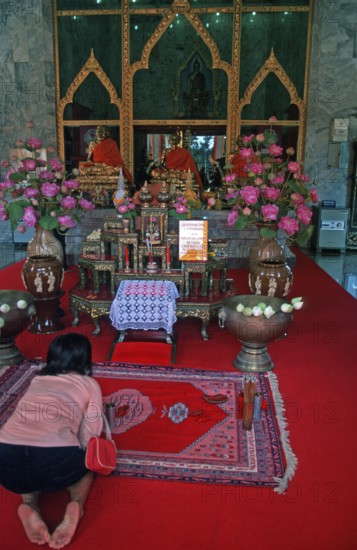 Believers pray at Wat Chalong monastery, Ko Phuket, Thailand, December 2002, vintage, retro, old,