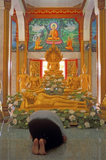 Believer praying, Wat Chalong monastery, Ko Phuket, Thailand, December 2002, vintage, retro, old,