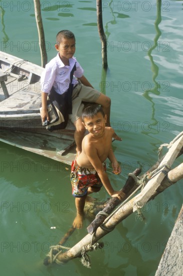 Little boys, children in the stilt village of Ko Pannyi in Phangnga Bay near Ko Phuket, two years