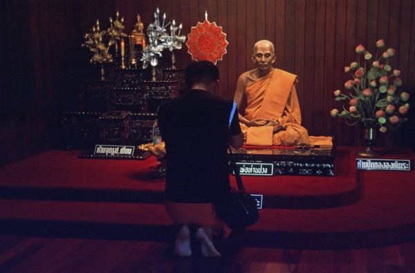 Wax monk at Wat Chalong monastery, believer praying, Ko Phuket, Thailand, December 2002, vintage,