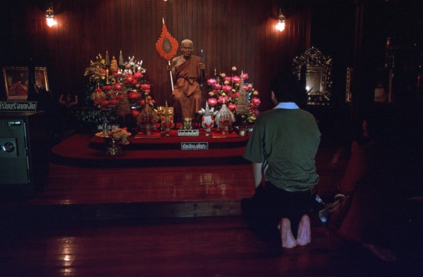 Wax monk at Wat Chalong monastery, believers praying, Ko Phuket, Thailand, December 2002, vintage,