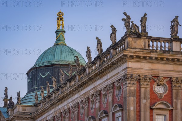 Figures and statues at the new palace in Sanssouci Park in the evening light, Potsdam