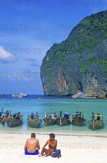 People, longtail boats on Maya Bay beach, known from the movie The Beach, one year in front of the