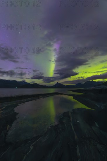 The Vestfjord in Nordland, Norway, has an enchanting atmosphere at night. Dark clouds and vivid