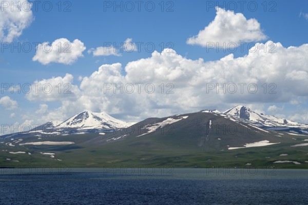 Majestic snow-capped mountains above a deep blue lake, Lake Parawani, Samtskhe—Javakheti Highlands,