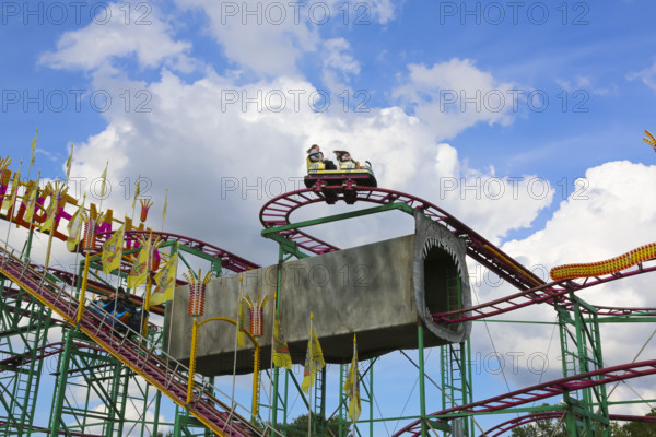 Wilde Maus, little rollercoaster for children, fairground in Friedrichsau Ulm, public festival,
